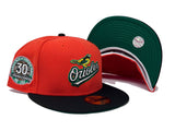 BALTIMORE ORIOLES 30TH ANNIVERSARY GLOW IN THE DARK " PUMPKIN COLLECTION" GREEN BRIM NEW ERA FITTED HAT