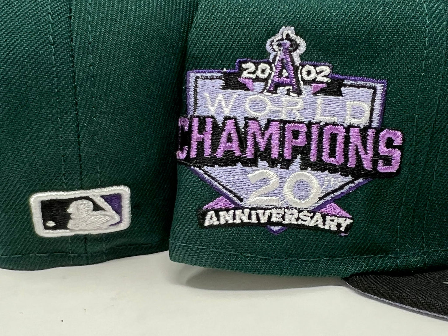 LOS ANGELES ANGELS 2002 WORLD CHAMPIONS LAVENDER BRIM NEW ERA FITTED HAT